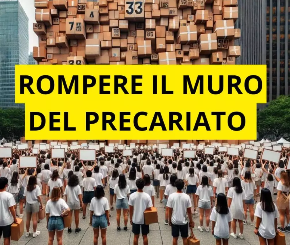 Docenti precari che protestano davanti ad un muro di cartoni e con la scritta "Rompere il muro del precariato"